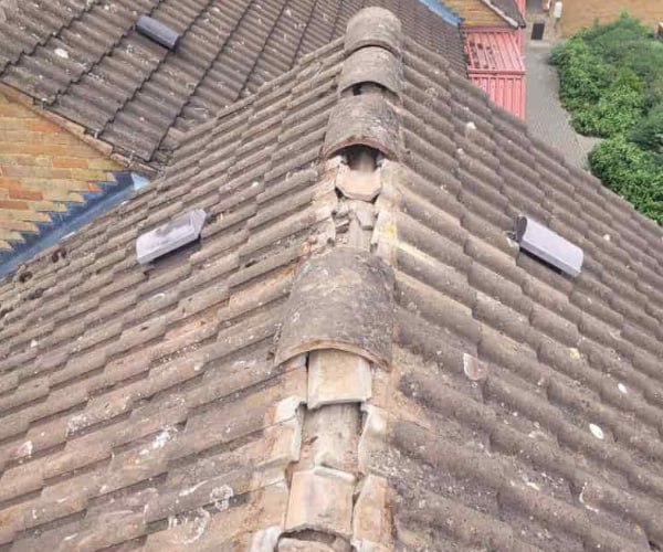 This is a photo if a roof ridge which has missing tiles. The ridge tiles are being replaced by JYT Roofing Hitchin